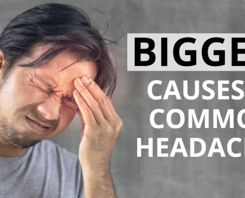 Man holding his head because of a headache